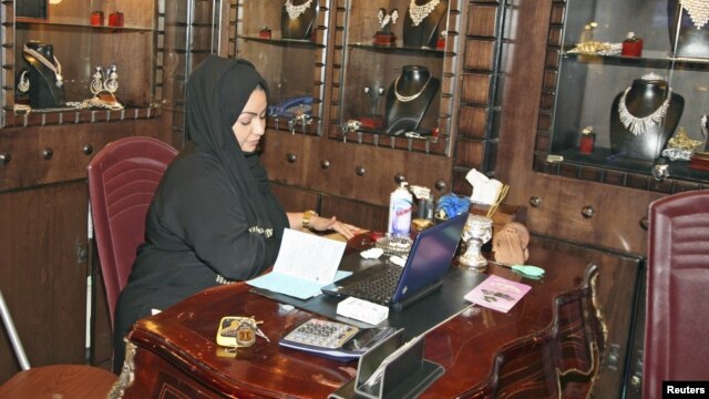 A Saudi saleswoman works at a jewelry shop in Jeddah, January 9, 2012. 