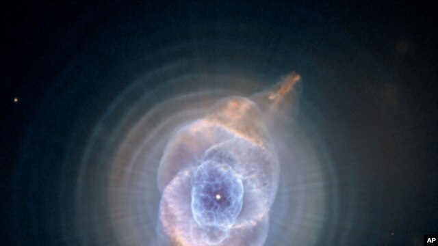 This image of the Cat's Eye Nebula, captured by the Hubble telescope, is one of the first planetary nebulae discovered and has one of the most complex forms known to this kind of nebula. Eleven rings, or shells, of gas make up the Cat's Eye.