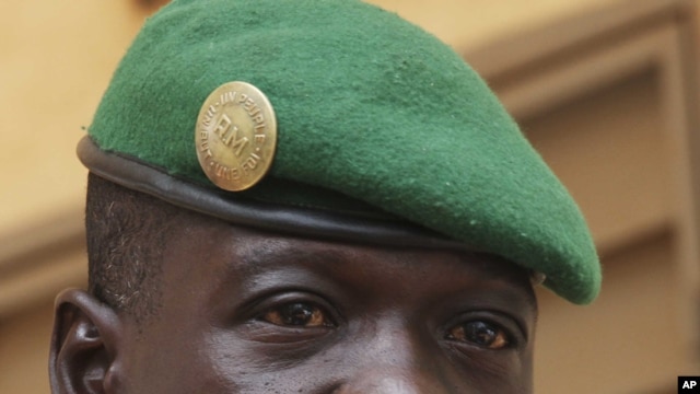 Captain Amadou Sanogo, leader of Mali's military junta, speaks during a news conference at his headquarters in Kati, outside Bamako, March 30, 2012. 