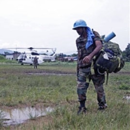 UN troops walk past as they provide security for villagers at the small village of Walikale (File)