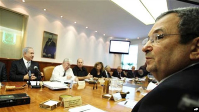 Israeli Prime Minister Benjamin Netanyahu, left, and Israeli Defense Minister Ehud Barak, front right, at a cabinet meeting that approved a controversial bill requiring new citizens to pledge allegiance to a "Jewish and democratic" state. Jerusalem, 10 Oc