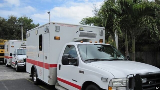These ambulances, parked behind Notre Dame d'Haiti's school yard,  were donated to Haiti by the city of Chicago