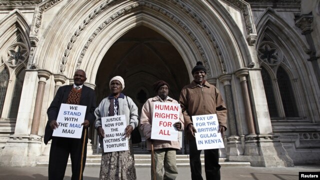 Wambugu Nyingi, Jane Muthoni, Paul Nzili and Ndiku Mutua (L-R) stand outside the High Court in London April 7, 2011. 