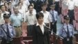 谷开来(中间站立者)2012年8月9日在合肥市中级人民法院出庭受审