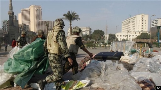 Egyptian Army soldiers remove tents of protesters from Tahrir Square in Cairo, Egypt, Sunday, Feb. 13, 2011. Egypt's military has started taking down the makeshift tents of protesters who camped out on Tahrir Square in an effort to allow traffic and norma