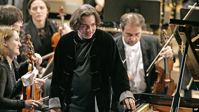 Turkish pianist Fazil Say, center, plays during a performance at the World Economic Forum in Davos, Switzerland, Jan. 31, 2009. 