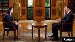 Syria's President Bashar al-Assad speaks during an interview with China's state television CCTV, in Damascus, Sept. 23, 2013.
