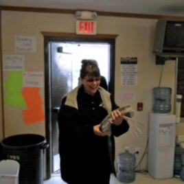 Lakota Country Times publisher Connie Smith arrives with the current issue of the Mustang News.