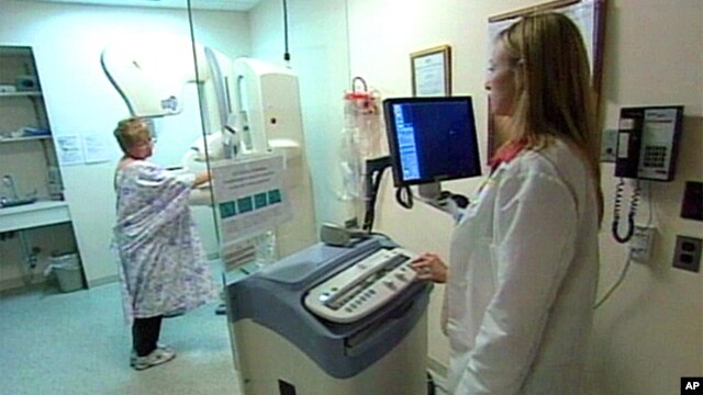 Woman taking mammogram test