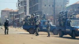Anti-riot policemen deploy across Conakry to separate rival gang fighters, March 1, 2013.