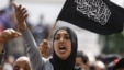 Pro-government supporters rally beside Salafist groups in Tunis April 9, 2013 to mark Martyr