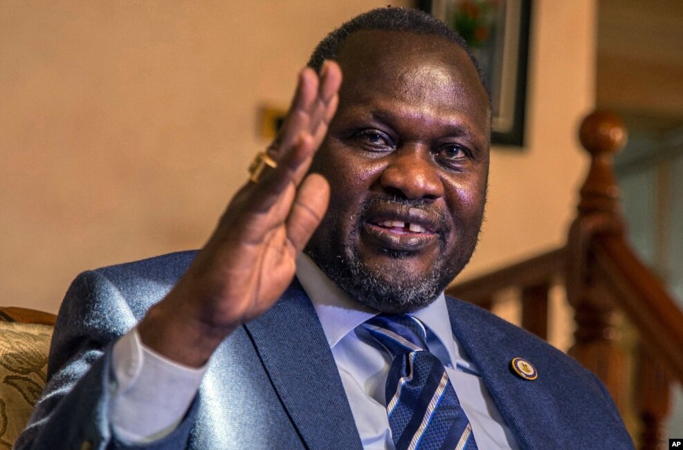 FILE — South Sudan rebel leader Riek Machar talks to reporters in Addis Ababa, Ethiopia, Feb. 13, 2016.