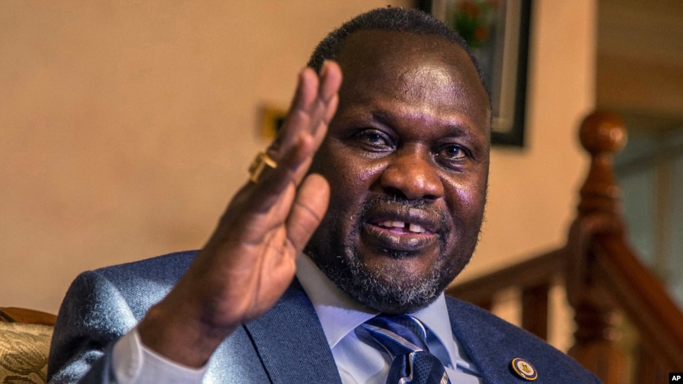 FILE - South Sudan rebel leader Riek Machar talks to reporters in Addis Ababa, Ethiopia, Feb. 13, 2016. Machar fled from Juba in January shortly after heavy fighting broke out in the capital between Machar’s forces and South Sudan army forces.
