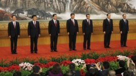 New members of the Politburo Standing Committee, from left, Zhang Gaoli, Liu Yunshan, Zhang Dejiang, Xi Jinping, Li Keqiang, Yu Zhengsheng and Wang Qishan stand in Beijing's Great Hall of the People, November 15, 2012.