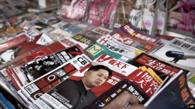 One of the magazines at a newspaper stand in Beijing highlights North Korea's new leader Kim Jong Un, December 30, 2011.