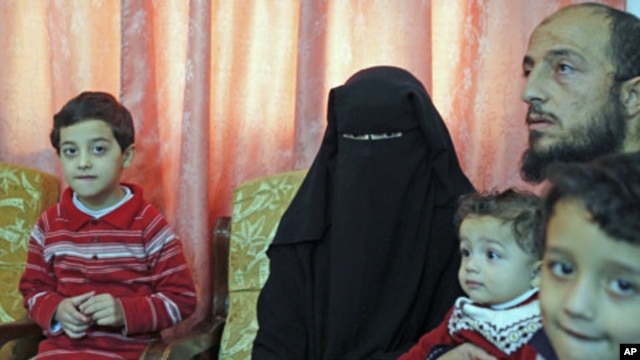 Syrian refugees who fled the violence in Syria speak to Reuters TV at their temporary home in Amman, Jordan, November 14, 2011.