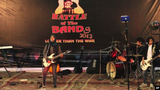 Members of Indian-controlled Kashmir’s first all-girl rock band Praagaash, or First Light, perform at the annual 'Battle of the Bands' in Srinagar, India, Dec. 23, 2012.
