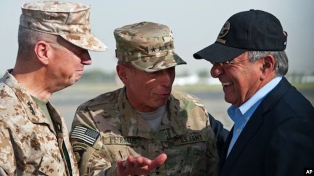 USMC Gen. John Allen, left, and Gen. David Petraeus, incoming CIA Director, greets former CIA Director and new U.S. Defense Secretary Leon Panetta as he lands in Kabul, Afghanistan, Saturday, July  9, 2011.