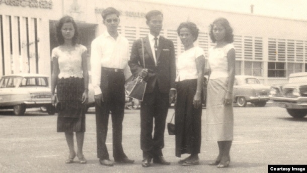 Tun Sovan, center, stands with his mother, two sisters and a brother-in-law. The photo was taken in front of Pochentong International Airport in 1962, before leaving to the United States. (Photo courtesy of Tun Sovan)