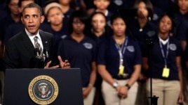 President Barack Obama speaks about strengthening the economy for the middle class and the nation's struggle with gun violence, at an appearance at Hyde Park Academy, in Chicago, Feb. 15, 2013.