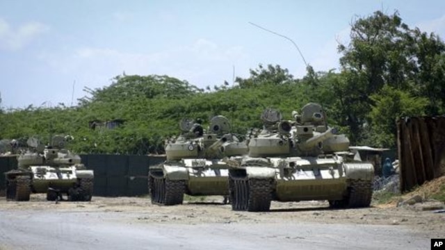 African Union tanks are seen guarding in front of their base in the Somali capital of Mogadishu, October 29, 2011.