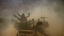 Israeli soldiers participate in a military exercise in the Israeli-controlled part of the Golan Heights, Sept. 19, 2012.