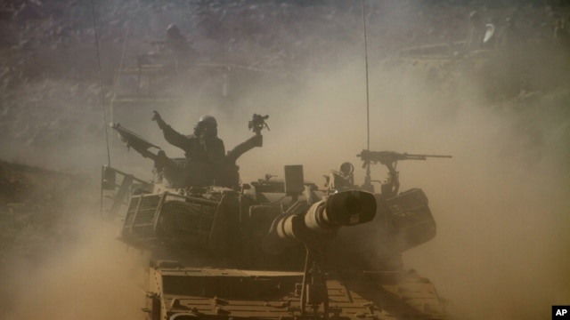Israeli soldiers participate in a military exercise in the Israeli-controlled part of the Golan Heights, Sept. 19, 2012.