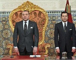 Morocco's King Mohamed VI with his Brother Prince Moulay Rachid, right, listens to the national anthem after he delivered a speech to the nation, March 9, 2011, at the king's Palace in Rabat