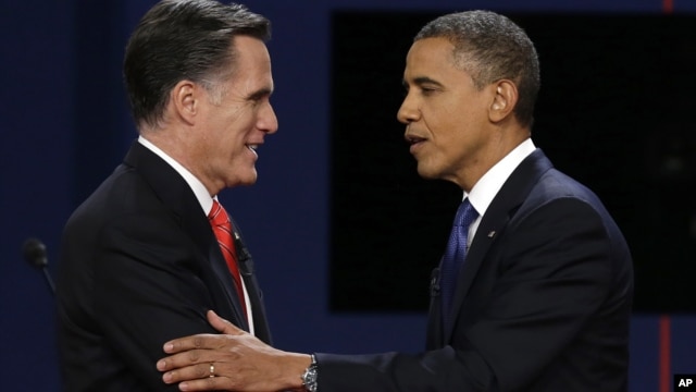 Republican presidential nominee Mitt Romney and President Barack Obama shake hands after the first presidential debate at the University of Denver, in Colorado, Oct. 3, 2012.p
