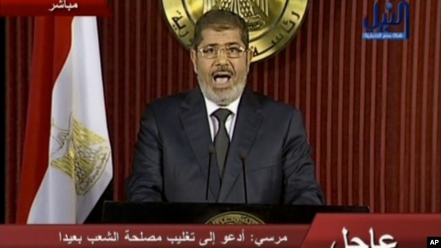 In this image made from video, Egyptian President Mohammed Morsi delivers a televised statement in Cairo, Egypt, Thursday, Dec. 6, 2012.