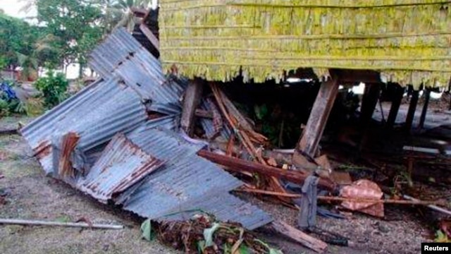 A damaged house is seen after a tsunami hit the Venga village on Solomon Islands, February 7, 2013. 