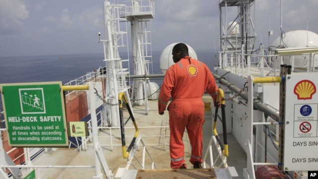 An unidentified Shell worker pictured aboard the Bonga offshore oil vessel off the coast of Nigeria, Dec. 26, 2011. 