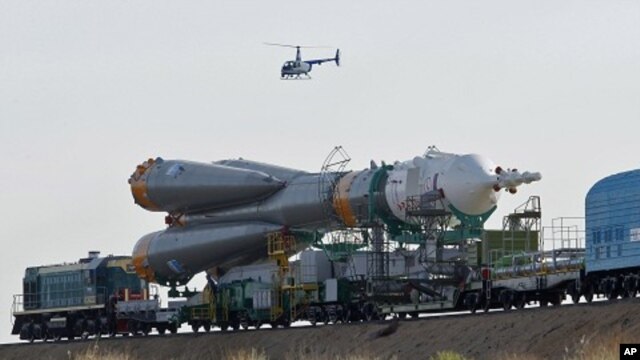 Russian Soyuz TMA-02M space ship that will carry new crew to the International Space Station, ISS, is transported from hangar to the launch pad at the Russian leased Baikonur cosmodrome, Kazakhstan (File Photo - June 5, 2011)