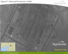 An image released by NATO on April 10, 2014 that shows tanks and infantry fighting vehicle elements of the Russian Motor Rifle Regiment near Kuzminka, Russia, near Ukraine. (DigitalGlobe/NATO ACO PAO)