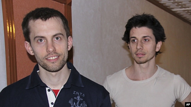 In this May 21, 2010 file photo, American hikers Shane Bauer, left, and Josh Fattal are shown in Tehran, Iran. The lawyer for two Americans jailed as spies in Iran says a $1 million bail-for-freedom deal has been approved by the courts, clearing the way f