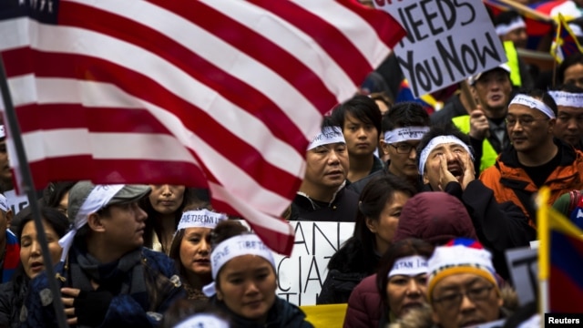 Protesters take part in a solidarity march from the Chinese Consulate to the United Nations (UN) Headquarters in support of Tibet in New York, December 10, 2012. The march also aims to brings to attention a string of self-immolations that have taken place