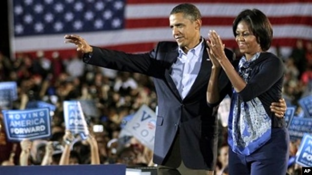 President Barack Obama and first lady Michelle Obama muster support for Democratic candidates during a rally at Ohio State University in Columbus, Ohio, 17 Oct. 2010.