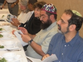 Jews and Muslims, seated side-by-side, share their thoughts during a Passover Seder at the All Dulles Area Muslim Society (ADAMS).