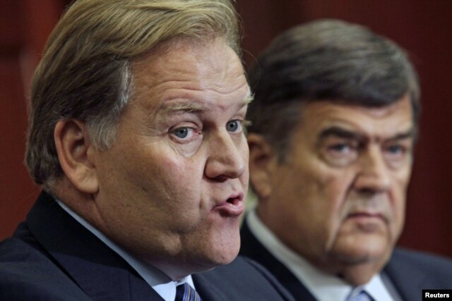 House Intelligence Committee Chairman Mike Rogers (R-MI) (L) and Rep. Dutch Ruppersberger (D-MD) hold a news conference to release a report on "national security threats posed by Chinese telecommunications companies Huawei and ZTE" on Capitol Hill in Washington, October 8, 2012.