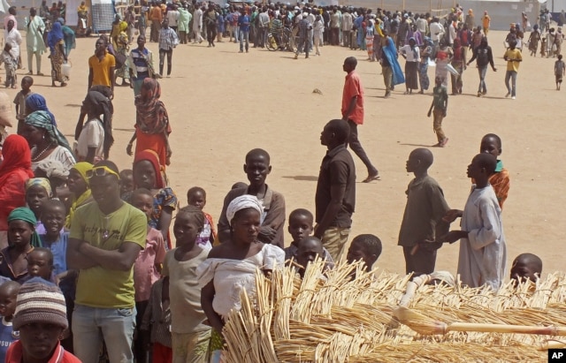 FILE - People who fled their homes due to violence from the Islamic extremists group Boko Haram are seen inside a refugee camp in Minawao, Cameroon, Feb. 25, 2015.