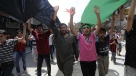 Syrians hold anti-government protest in Aleppo, Syria, July 27, 2012.