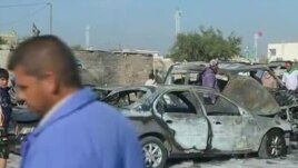 Hoton wata mota da bam ya fasa kennan a Iraqi. 