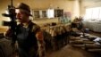 A member of the Iraqi counterterrorism forces stands by an Islamic State militants weapons factory in Falluja, Iraq, June 23, 2016.