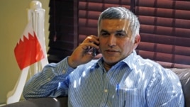 Bahrain human rights activist Nabeel Rajab talks on his mobile phone upon arriving home in Budaiya, west of Manama, after being detained for over two weeks, May 28, 2012.