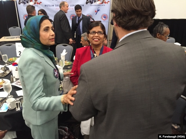Sarwat Husain (left, in a green jacket) at the AMDC Luncheon at the Pennsylvania Convention Center during the Democratic National Convention.