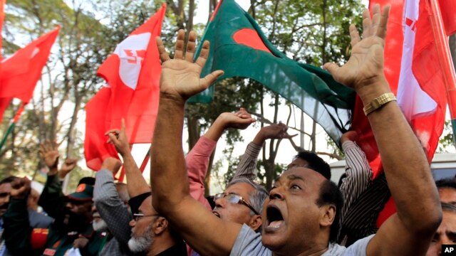 Bangladeshi activists shout slogans as they celebrate outside the International Crimes Tribunal where leaders of the country’s largest Islamic party the Jamaat-e-Islami party are on trial in Dhaka, Bangladesh, Feb. 5, 2013.