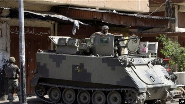 Soldiers deployed at Syria street, which divides Sunni and Alawite areas of Tripoli, Lebanon, June 3, 2012.