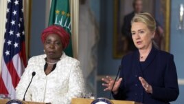 Secretary of State Hillary Rodham Clinton speaks to the media as African Union Chairperson Nkosazana Dlamini-Zuma, listens after their meeting in Washington, November 28, 2012.
