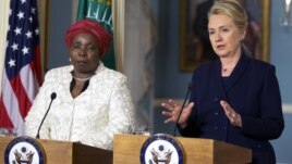 Secretary of State Hillary Rodham Clinton speaks to the media as African Union Chairperson Nkosazana Dlamini-Zuma, left, listens after their meeting at the Department of State in Washington, Wednesday, Nov. 28, 2012. 