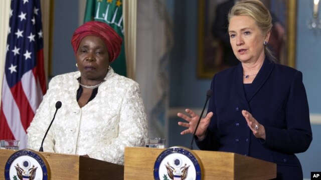 Secretary of State Hillary Rodham Clinton speaks to the media as African Union Chairperson Nkosazana Dlamini-Zuma, left, listens after their meeting at the Department of State in Washington, Wednesday, Nov. 28, 2012. 